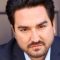 stock-photo-93331683-intense-dark-man-staring-into-camera