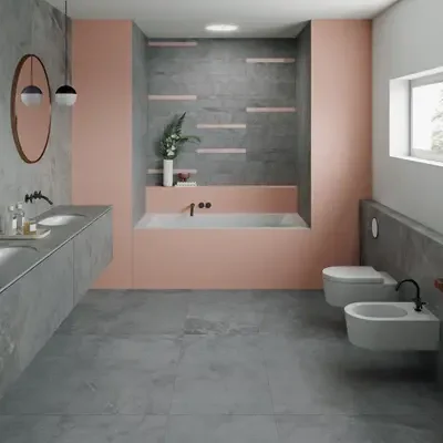 Modern bathroom with dual sinks, pink accents, and a bathtub with gray tiles. Features floating sinks, round mirrors, and bidet fixtures under a large window.