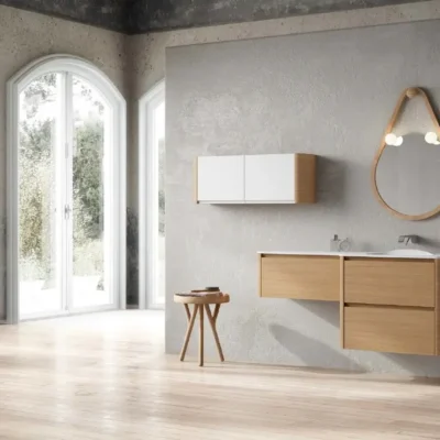 Modern bathroom with a freestanding bathtub, glass shower enclosure, and a wooden vanity with a marble countertop. The walls are decorated with blue mosaic tiles and a large mirror.